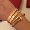 Bracelet tendance en or, cuff en acier inoxydable plaqué or 18k incrusté de zircon, tendance open bracelet, gold cuff bangle, gold PVD plated stainless steel.
